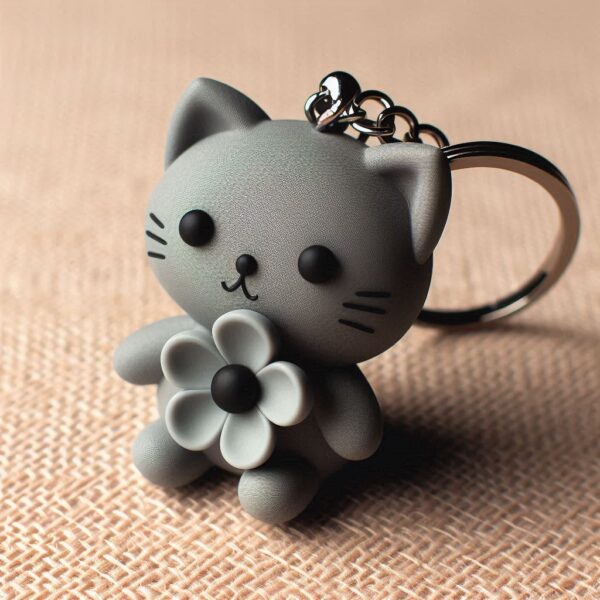 llavero simple con forma de gatito gris con una flor sin fondo Llavero michi gris